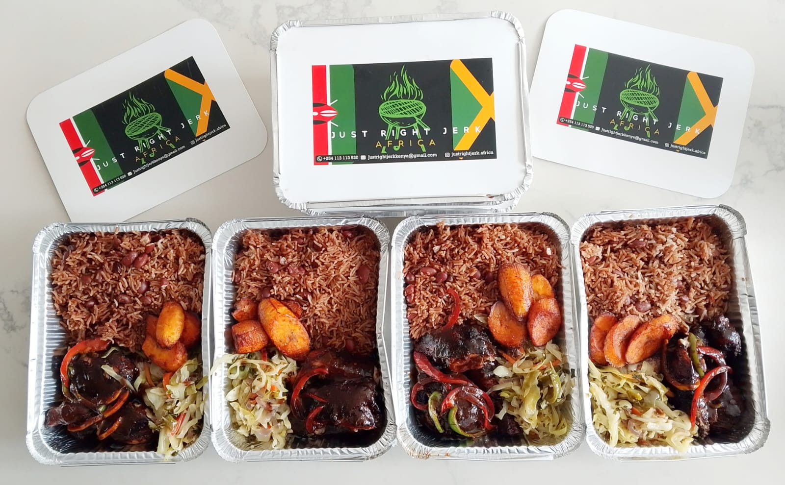 Nyam & Scram Jerk Chicken Quarter with rice and peas – authentic Jamaican food Point District